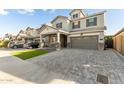 Attractive two-story home with a paved driveway and well-maintained landscaping at 717 E Deer Creek Rd, Phoenix, AZ 85048