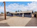 A shot of the backyard with a fresh modern paint job at 8014 N 55Th Ave, Glendale, AZ 85302