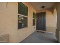 Covered entryway featuring a security door, adjacent windows, and a welcome mat at 919 S Pheasant Dr, Gilbert, AZ 85296