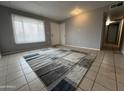 Light filled living room showing neutral paint, and tile floors at 1210 E Marny Rd, Tempe, AZ 85288