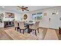 Elegant dining area with modern decor, wood floors, and plenty of natural light at 14446 N 40Th Pl, Phoenix, AZ 85032