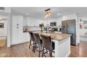 Well-appointed kitchen featuring white cabinets, granite countertops, and stainless steel appliances at 14446 N 40Th Pl, Phoenix, AZ 85032