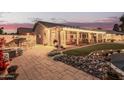 Covered backyard patio with string lights perfect for outdoor dining and entertaining at 1453 E Butler Cir, Chandler, AZ 85225