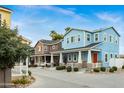 Charming street view showcases a variety of colorful homes with inviting porches at 16875 N 12Th St # 24, Phoenix, AZ 85022