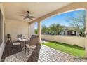 Covered patio with outdoor seating, perfect for relaxing and entertaining at 16945 W Vernon Ave, Goodyear, AZ 85395