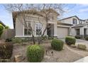 Beautiful home featuring manicured landscaping, gravel, and mature trees at 18007 N 66Th Way, Phoenix, AZ 85054