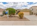 Charming single-story home with a two-car garage, desert landscaping, and mature trees in a desirable neighborhood at 18178 W Desert View Ln, Goodyear, AZ 85338