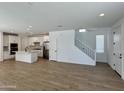 Spacious open-concept floor plan integrating the kitchen, dining, and living areas with tile flooring at 1909 W Lariat Ln, Phoenix, AZ 85085