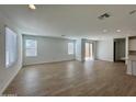 Bright, open living space with tile flooring, big windows, and sliding glass doors to the back at 1909 W Lariat Ln, Phoenix, AZ 85085
