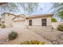 Well-kept single-story home with desert landscaping and a cozy, inviting entrance at 2439 W White Feather Ln, Phoenix, AZ 85085