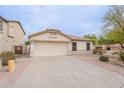 Beautiful single-story home featuring a spacious driveway and well-maintained landscaping at 2439 W White Feather Ln, Phoenix, AZ 85085