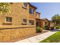 Inviting two-story townhouse with well-maintained landscaping and a welcoming facade at 250 W Queen Creek Rd # 146, Chandler, AZ 85248