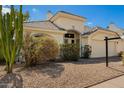 Charming single-story home with low-maintenance landscaping, two-car garage and neutral-toned stucco at 3357 W Barcelona Dr, Chandler, AZ 85226