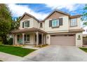 Lovely two-story home featuring a covered porch and an attached two-car garage at 3632 E Comstock Dr, Gilbert, AZ 85296