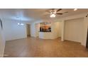 Open living room with tile flooring, bright lighting, and neutral walls at 3829 W Ashton Dr, Anthem, AZ 85086