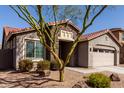 Inviting exterior view of a home with a stone-accented entrance and low-maintenance landscaping at 4116 E Roy Rogers Rd, Cave Creek, AZ 85331