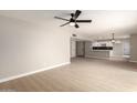 Bright living room with light wood flooring and recessed lighting at 5208 W Earll Dr, Phoenix, AZ 85031