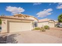 Inviting home exterior boasting a spacious driveway and desert-style landscaping at 6718 E Northridge St, Mesa, AZ 85215