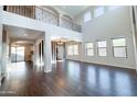 Spacious living room with high ceilings, dark floors, and large windows at 6812 S 45Th Ave, Laveen, AZ 85339