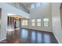 Open concept living room featuring dark wood floors and lots of natural light at 6812 S 45Th Ave, Laveen, AZ 85339