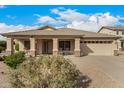 Charming single-story home with a well-manicured front yard and a two-car garage in a quiet neighborhood at 700 W Gascon Rd, San Tan Valley, AZ 85143