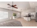 Bright, open-concept living space with vaulted ceilings and an eat-in kitchen at 9212 W Salter Dr, Peoria, AZ 85382