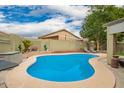 Sparkling pool in a private backyard with desert landscaping and lounge chairs, ideal for relaxation at 9212 W Salter Dr, Peoria, AZ 85382