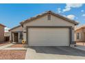 Charming home featuring a well-maintained front yard and a convenient two-car garage at 11813 W Sierra St, El Mirage, AZ 85335