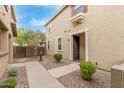 Front entrance featuring desert landscaping, walkway, and security door at 1265 S Aaron -- # 355, Mesa, AZ 85209