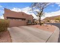 Single level home with two-car garage and desert landscaping in a suburban neighborhood at 1312 N Joplin Cir, Mesa, AZ 85207