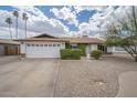 Beautiful single-Gathering home showcasing a well-maintained yard, and a spacious driveway at 2254 S Noche De Paz --, Mesa, AZ 85202