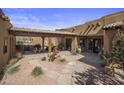 Courtyard features a fountain and comfortable seating, with a horse statue at 31912 N 141St St, Scottsdale, AZ 85262