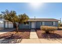 Charming single-story home with a low-maintenance front yard and covered parking at 346 S Florence St, Casa Grande, AZ 85122