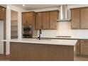 Modern kitchen with stainless steel appliances, white countertops, and a large center island at 40234 N Alegre Dr, San Tan Valley, AZ 85140