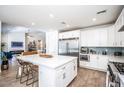 Bright kitchen with white cabinets, stainless steel appliances, and large center island at 4115 E Windsor Ave, Phoenix, AZ 85008