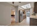 Open-concept kitchen with stainless steel appliances and a view into the adjacent living area at 4720 E Elena Ave, Mesa, AZ 85206