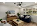 Bright living room with large windows, modern furniture, and stylish decor at 6841 E Osborn Rd # C, Scottsdale, AZ 85251