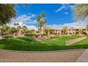 Beautifully landscaped grounds with a grassy area and mature trees, perfect for outdoor activities at 10030 W Indian School Rd # 226, Phoenix, AZ 85037