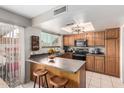 Efficient kitchen featuring bar stool seating, ample counter space, and modern appliances at 12402 N 36Th Dr, Phoenix, AZ 85029