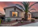 Charming single-story home with a well-manicured front yard with rock landscaping and shutters at 18259 W Buena Vista Dr, Surprise, AZ 85374