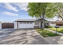 Charming single-story home with well-manicured lawn and a spacious two-car garage and stylish finishes at 1849 E 2Nd Pl, Mesa, AZ 85203