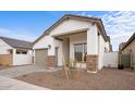 Beautiful single-story home featuring a two car garage, covered porch, and stone accents at 20318 W Turney Ave, Buckeye, AZ 85396