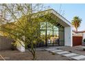 Exterior angle of a modern home, featuring desert landscaping and a geometric roof at 2336 N 12Th St, Phoenix, AZ 85006