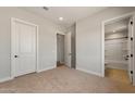 A spacious bedroom showcases the en-suite bathroom and closet layout at 26817 W Renee Dr, Buckeye, AZ 85396