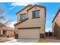 Charming two-story home with a neutral color palette and a convenient attached two-car garage at 35973 W Velazquez Dr, Maricopa, AZ 85138