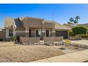 Charming home featuring desert landscaping and a neutral color palette at 4865 E Princess Dr, Mesa, AZ 85205