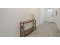 Bright entryway featuring stylish tile flooring and a modern console table with decor at 5360 S 98Th Pl, Mesa, AZ 85212