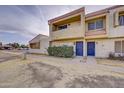 Multi-level townhome with a red tile roof, a stucco exterior, and a well-maintained front yard at 6333 N 49Th Ave, Glendale, AZ 85301