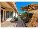 Relaxing outdoor patio featuring a hanging chair, vibrant plants, and stylish decor for serene enjoyment at 8812 E Riviera Dr, Scottsdale, AZ 85260