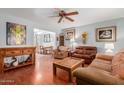 Cozy living room with wooden floors and a view into the dining area at 1022 W Watson Dr, Tempe, AZ 85283